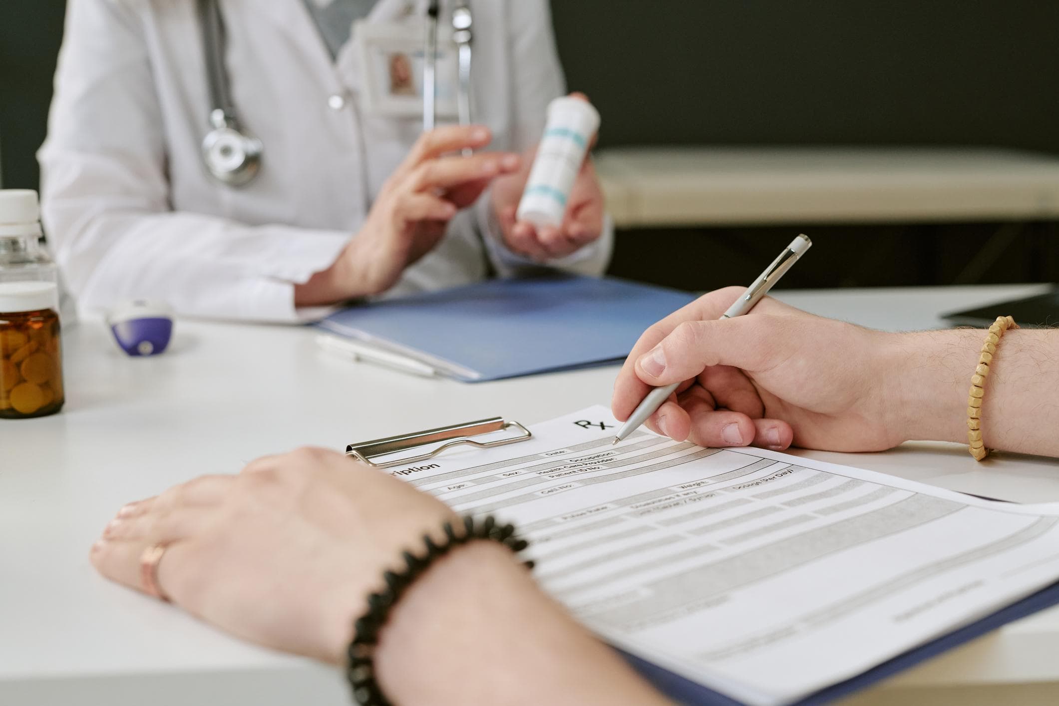 A clinician discussing a prescribed skincare product with a patient